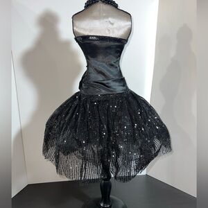 Decorative mannequin in sequence black dress. Very beautiful